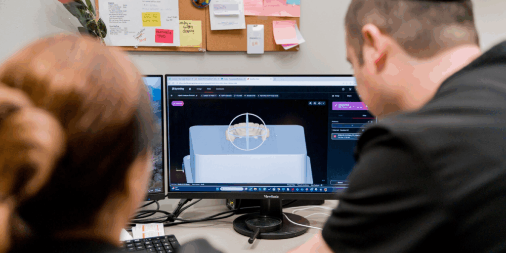 Designing a custom surgical guide using 3D dental software.